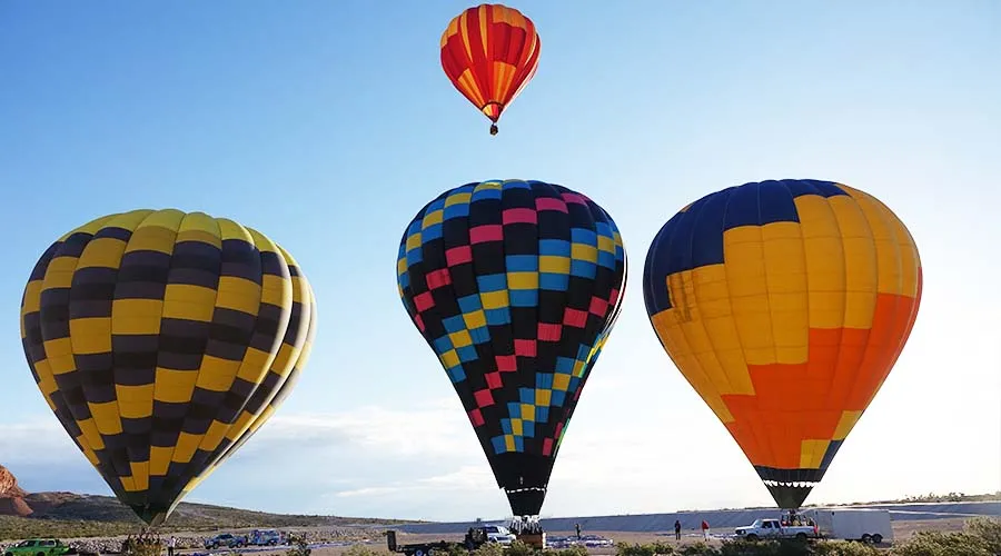 Hot Air Balloon Ride Las Vegas Colorful hot air balloons lifting off over desert terrain near Las Vegas at sunrise